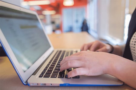 hands-typing-on-laptop-computer